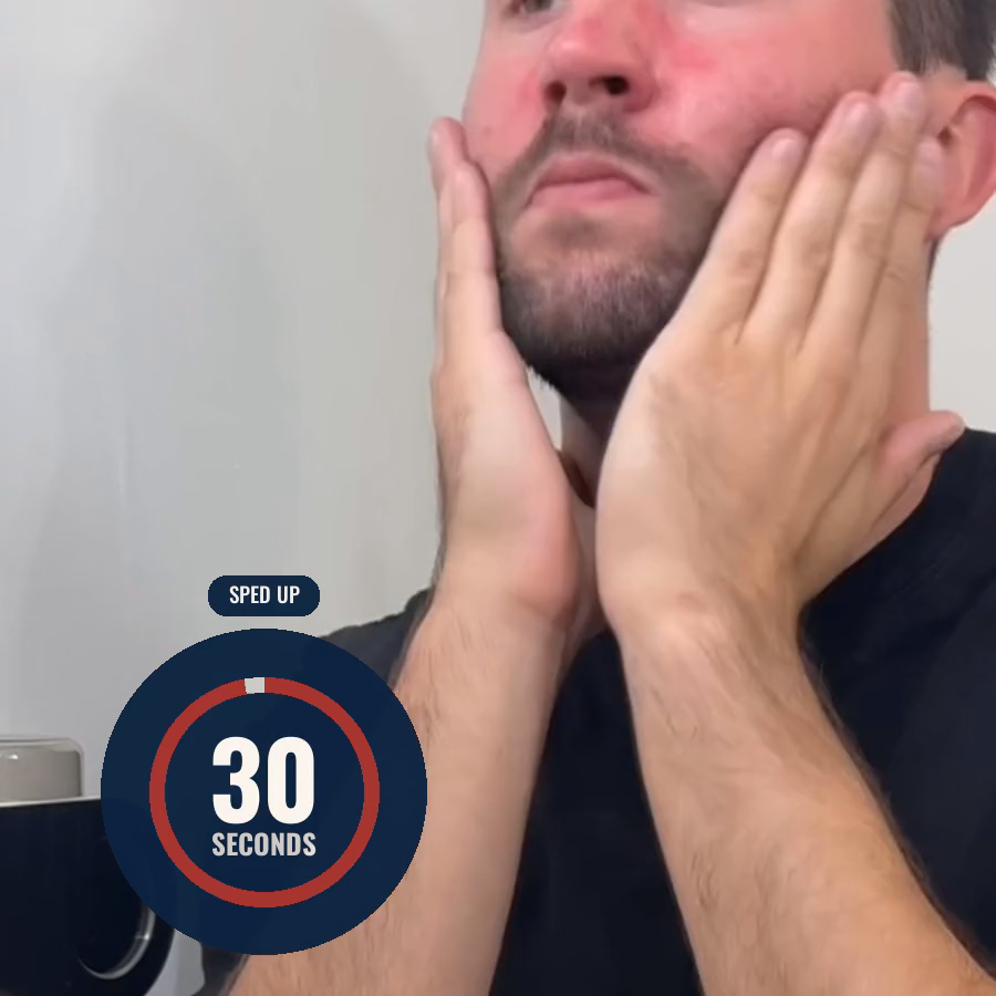 A man rubbing Revival into his cheeks and jaw with both hands, with the client's burned-in 30 seconds countdown badge in the corner.